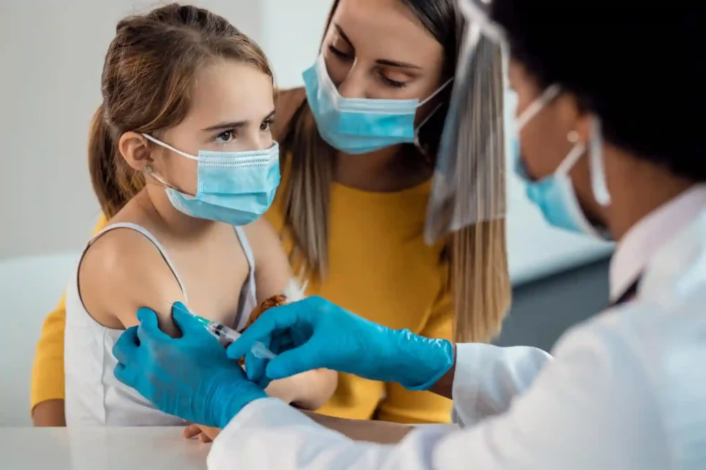 Illustration of a doctor giving vaccination to a child, promoting immunization and child health care.